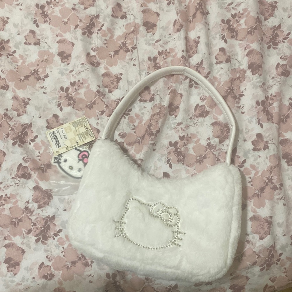 Hello everyone and welcome to my page,  I am selling A faux fur shoulder bag